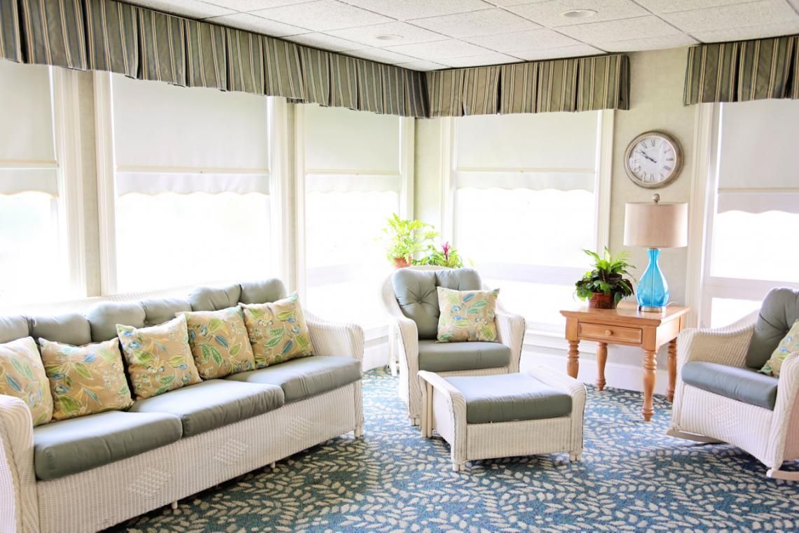Senior living room at The Edgewood Centre with modern furniture and architectural design.