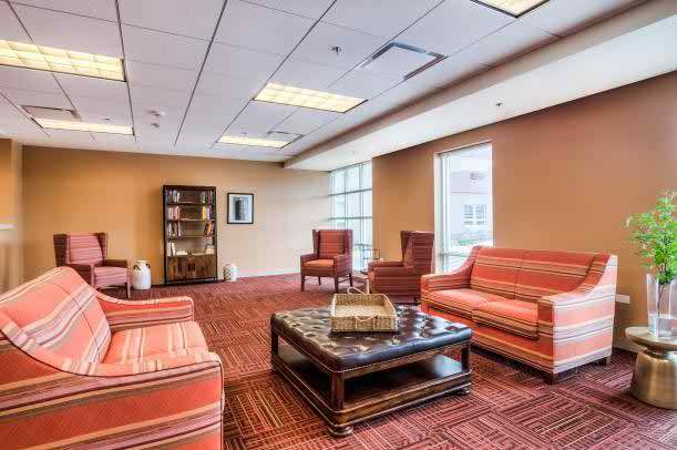 Interior view of Senior Suites of Bellwood featuring a welcoming reception room with modern decor.