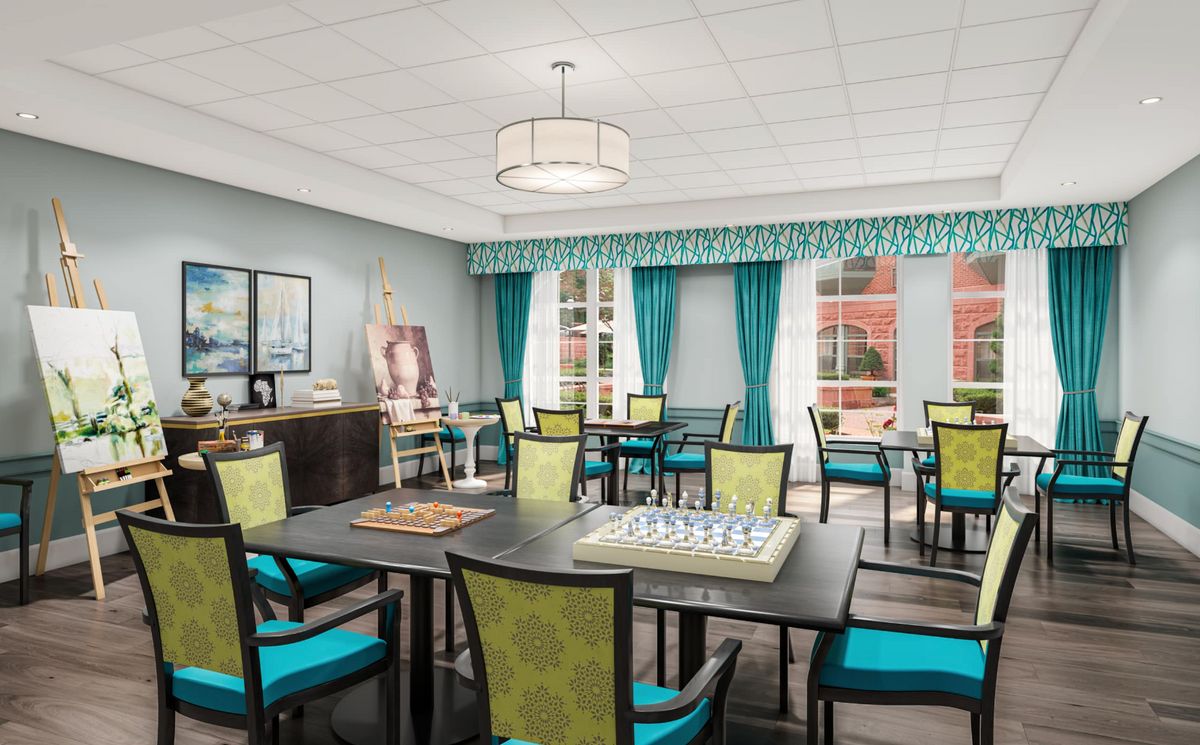 Interior view of The Residence At Boylston Place senior living community featuring dining area and lounge.