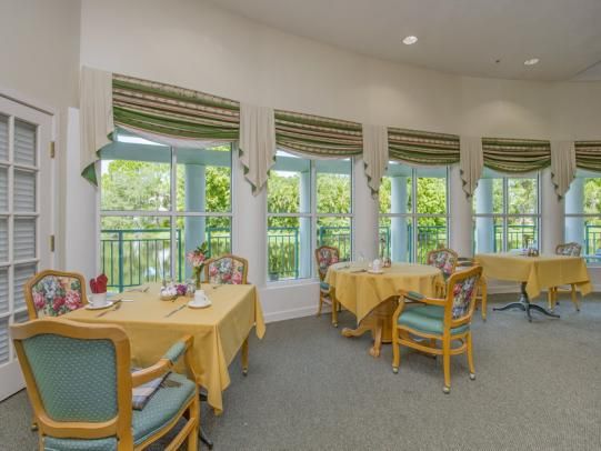 Elegant dining room setup at The Heron Club at Prestancia senior living community.