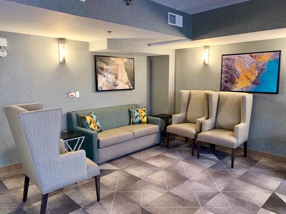 Indoor view of Jackson Park Supportive Living Facility featuring foyer, furniture, and art decor.