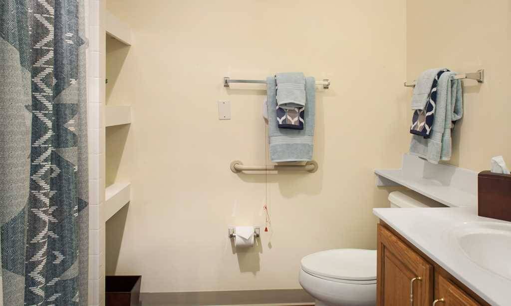 Clean and spacious bathroom with modern amenities at Fairmont Senior Living on Clayton.