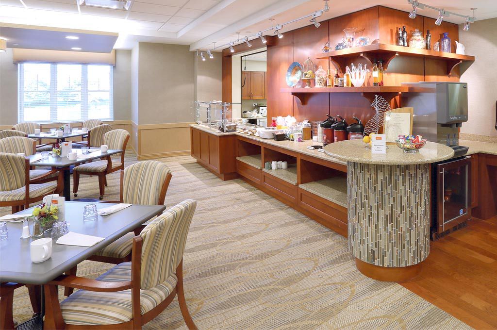 Interior view of Lutheran Home senior living community featuring dining room with wooden furniture.
