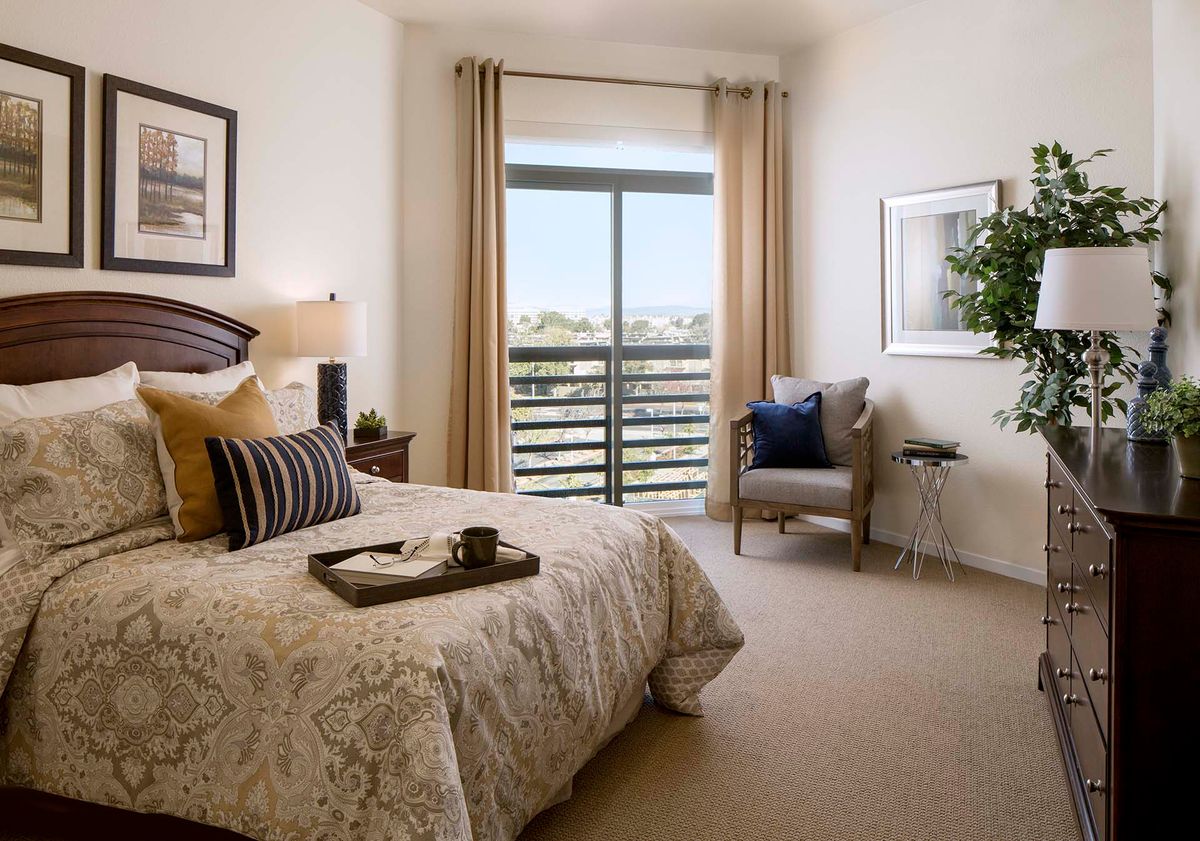 Interior view of a bedroom at Atria At Foster Square senior living community.