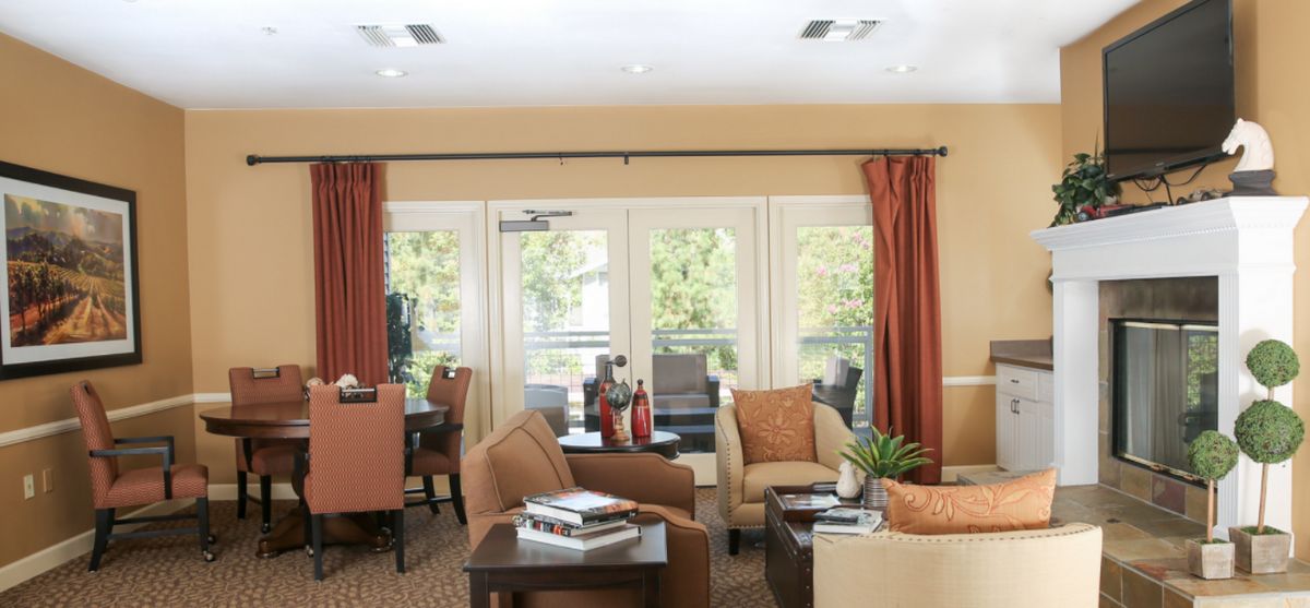 Senior living community interior at Whittier Place featuring modern decor, electronics, and art.