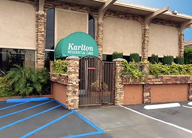 Karlton Residential Care Center, a senior living villa with canopy and gate in the city.