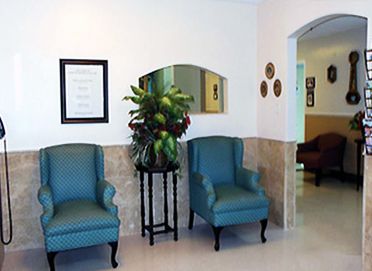 Interior view of Karlton Residential Care Center featuring reception area, furniture and décor.