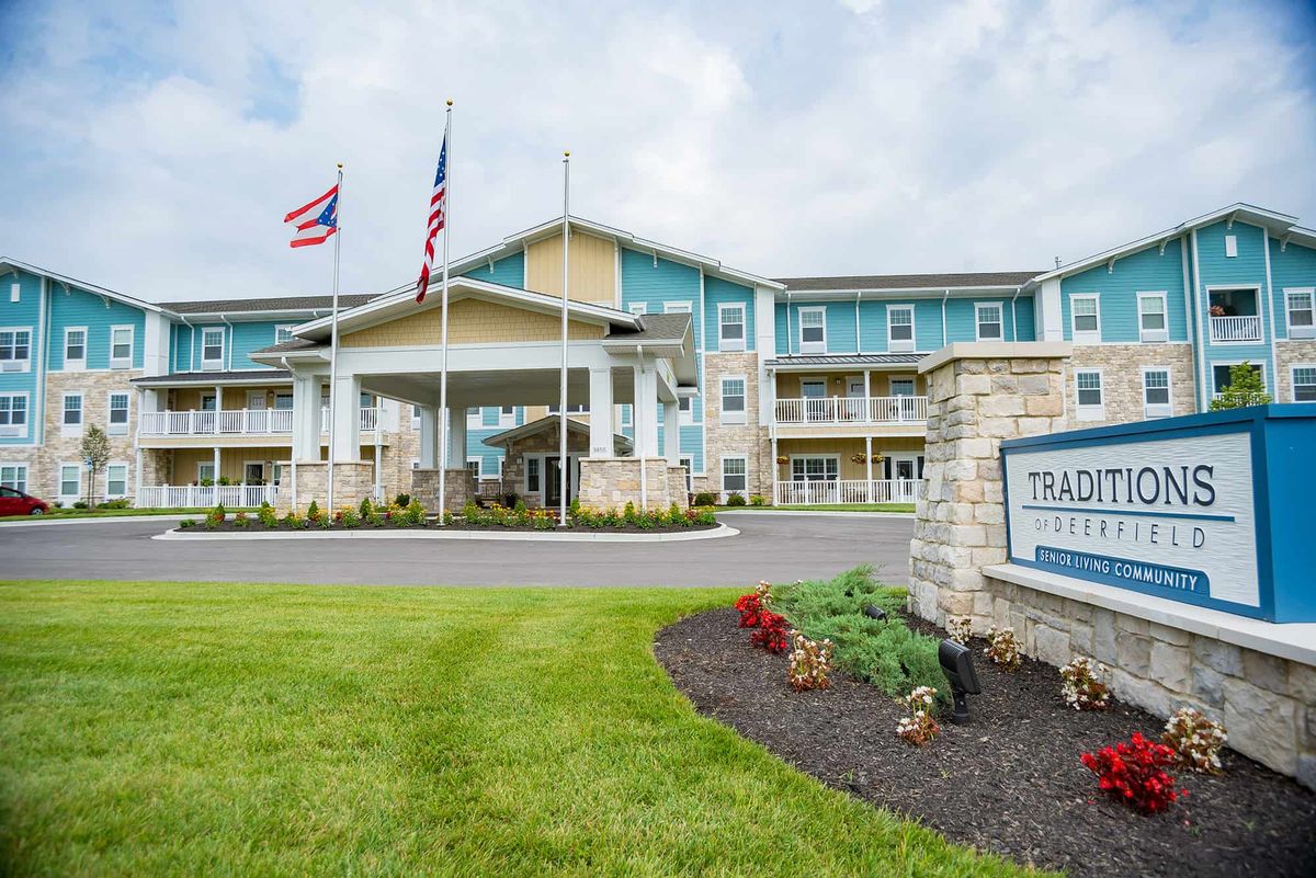 Senior living community, Deerfield, showcasing its architectural building amidst city suburb.
