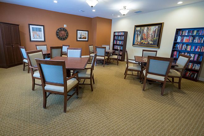 Interior view of Brookdale Franklin senior living community featuring dining area, library, and living room.