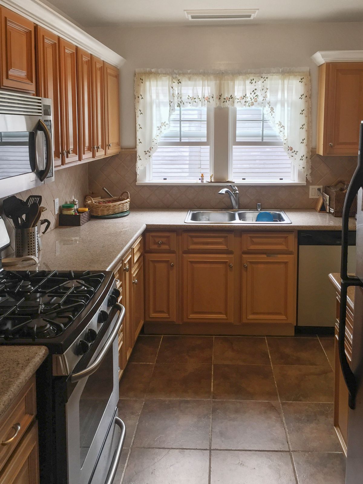 Interior view of Dryden Gardens senior living community featuring a well-designed kitchen with modern appliances.
