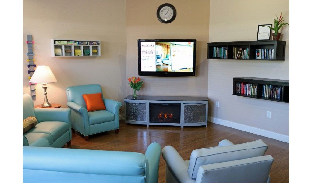 Interior view of A Banyan Residence senior living room with modern electronics and furniture.