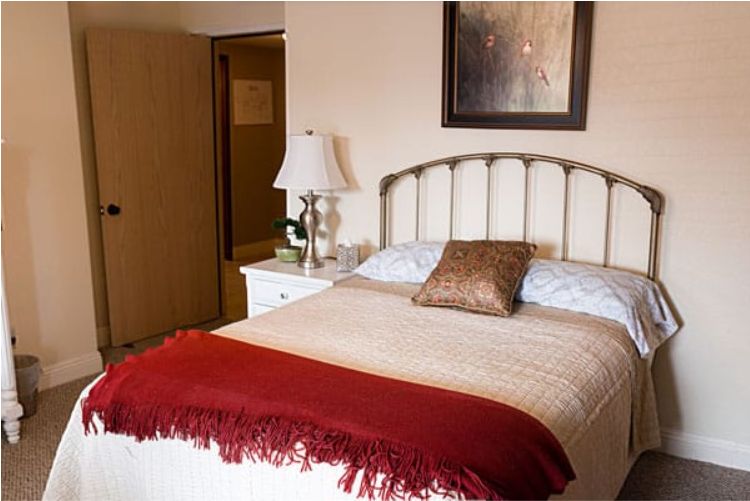 Interior design of a bedroom in Cushion senior living community, Ingleside By The Lake.