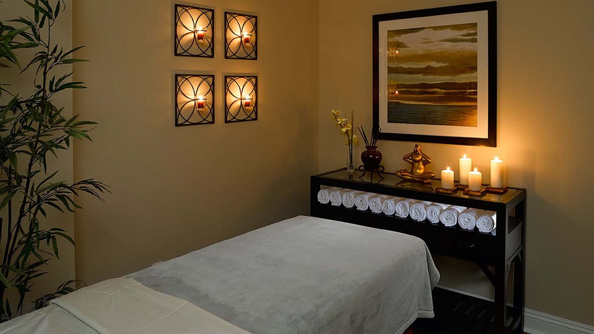 Spa corner with a candle at Atria Golden Creek senior living community featuring a bed and furniture.