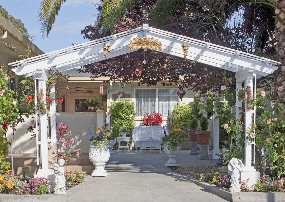 Senior living community, Valley Haven III, featuring outdoor patio, pergola, garden, and portico.