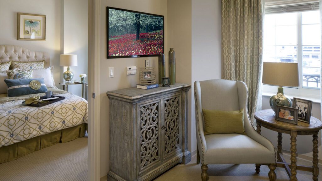 Interior view of Belmont Village Senior Living in San Jose featuring modern furniture and electronics.