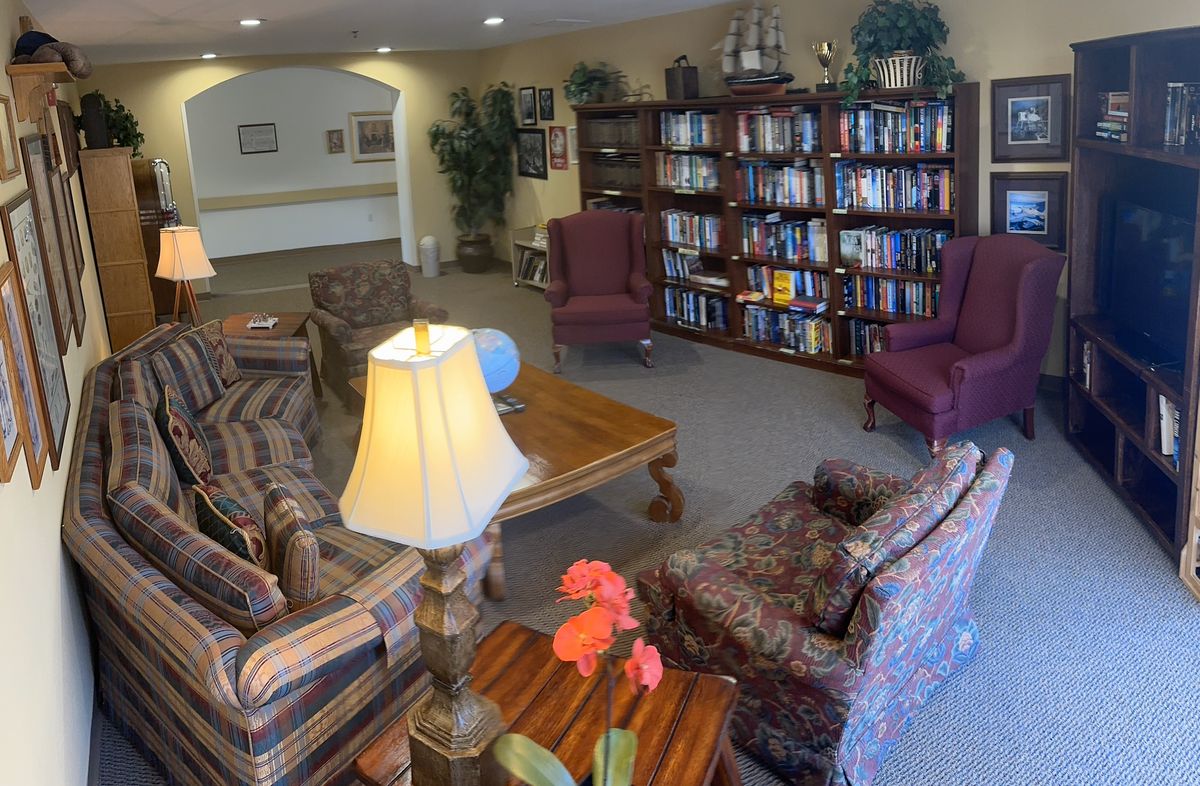 Senior living room interior at Leisure Vale Assisted Living with modern furniture and decor.