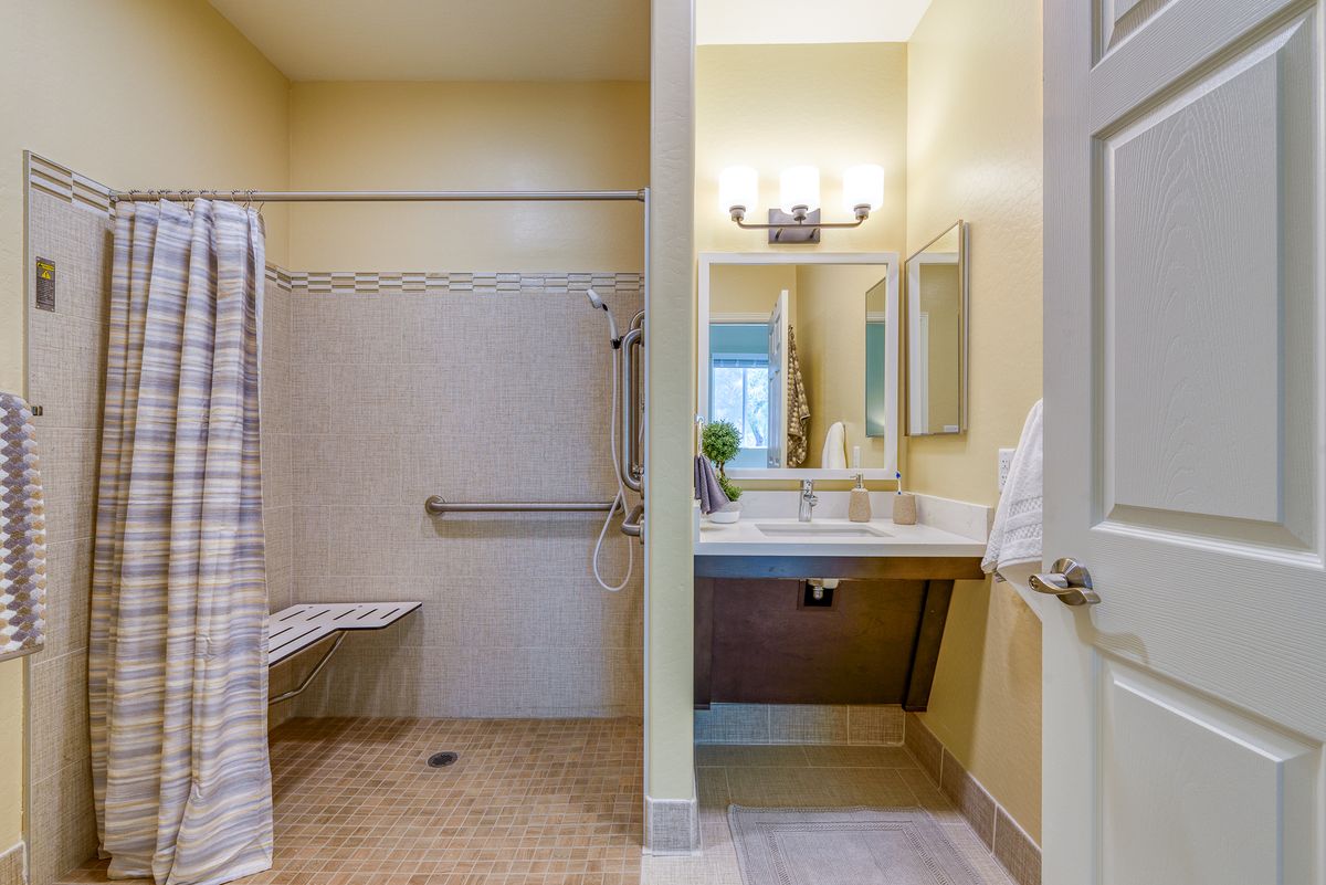 Interior view of a well-designed bathroom with modern flooring at Pacifica Senior Living Paradise Valley.