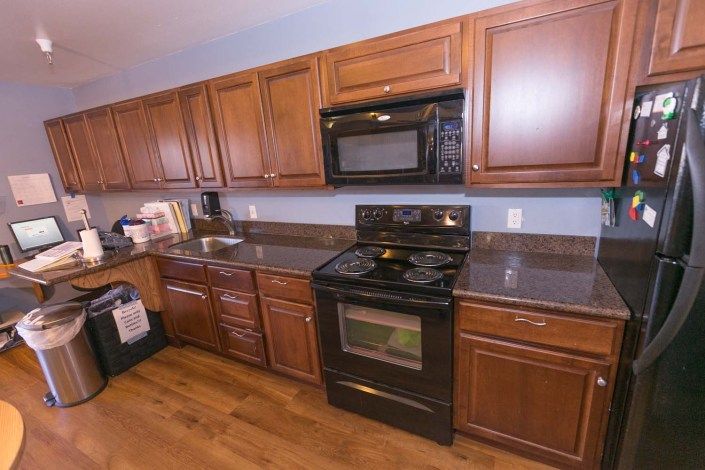 Modern kitchen in Park View Post Acute senior living community with various appliances.