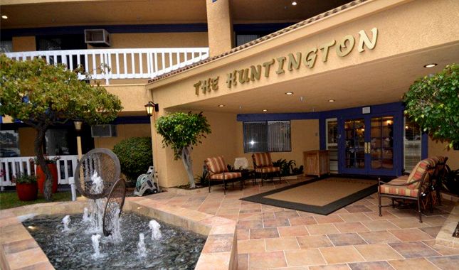 Senior living community, Huntington Retirement Hotel, featuring resort-like architecture and decor.