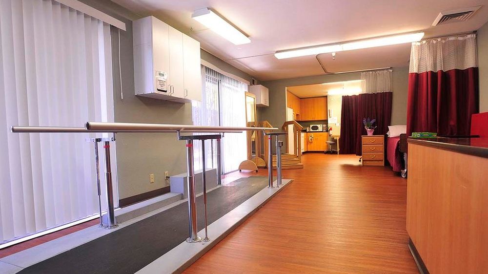 Interior view of Bay View Nursing & Rehab Center featuring wooden furniture and modern appliances.