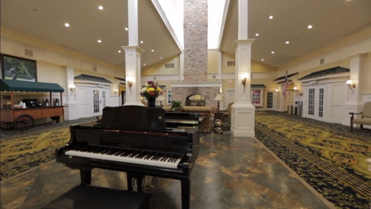 Senior musician performing on grand piano at Harmony Village at CareOne Stanwick Road.