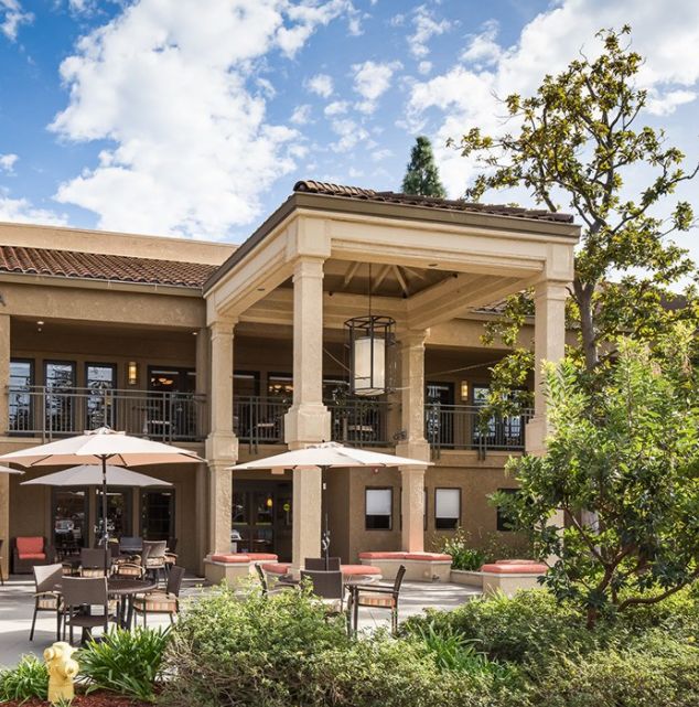 Senior living community, The Reserve At Thousand Oaks, featuring housing architecture and patio furniture.