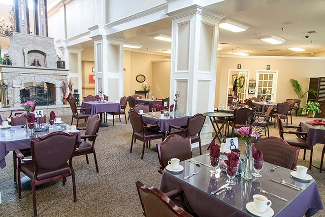 Interior view of Brookdale Chenal Heights senior living community featuring dining area and reception room.