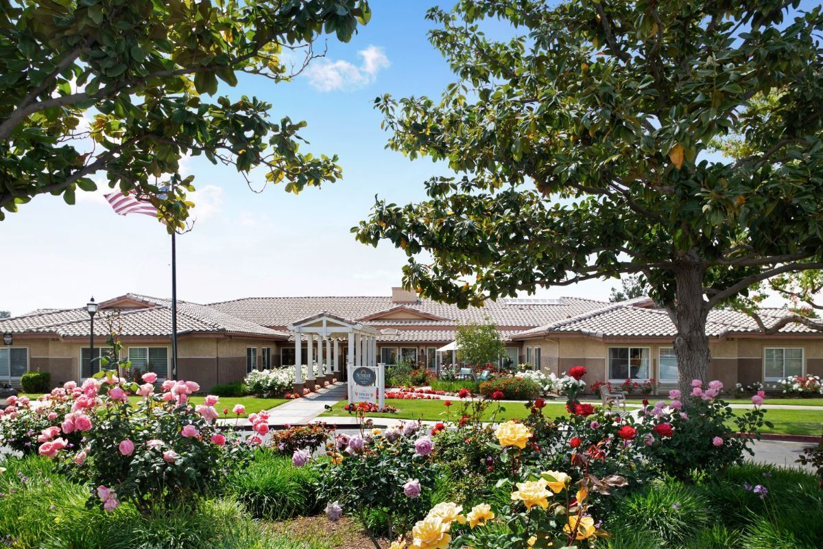 Senior living community, Canyon Crest, featuring lush gardens, roses, and villas in a suburban setting.