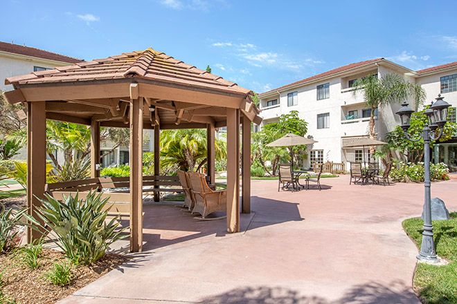 Outdoor patio with furniture and gazebo at Brookdale Irvine senior living community.