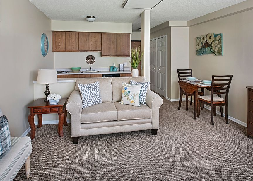 Interior view of American House Livonia senior living community featuring modern decor and furniture.