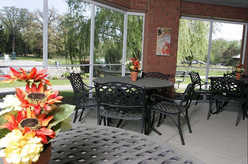 Senior residents enjoy a scenic outdoor meal at Presence Bethlehem Woods Retirement Community, La Grange.