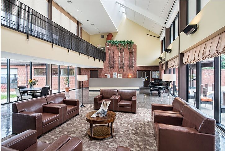 Interior view of The Clare Estate senior living community featuring elegant furniture and decor.