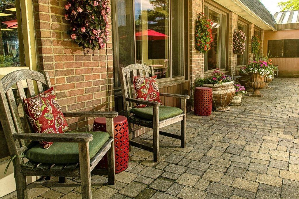 Interior and exterior view of Westland A Villa Center, a senior living community with modern architecture.