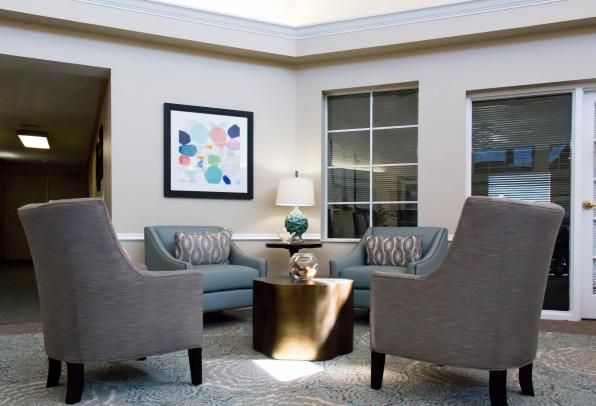 Senior living community Heron House featuring elegant furniture, home decor, and architecture.