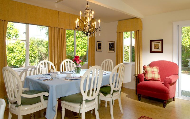 Interior view of Three Home Village senior living community featuring dining room with elegant decor.