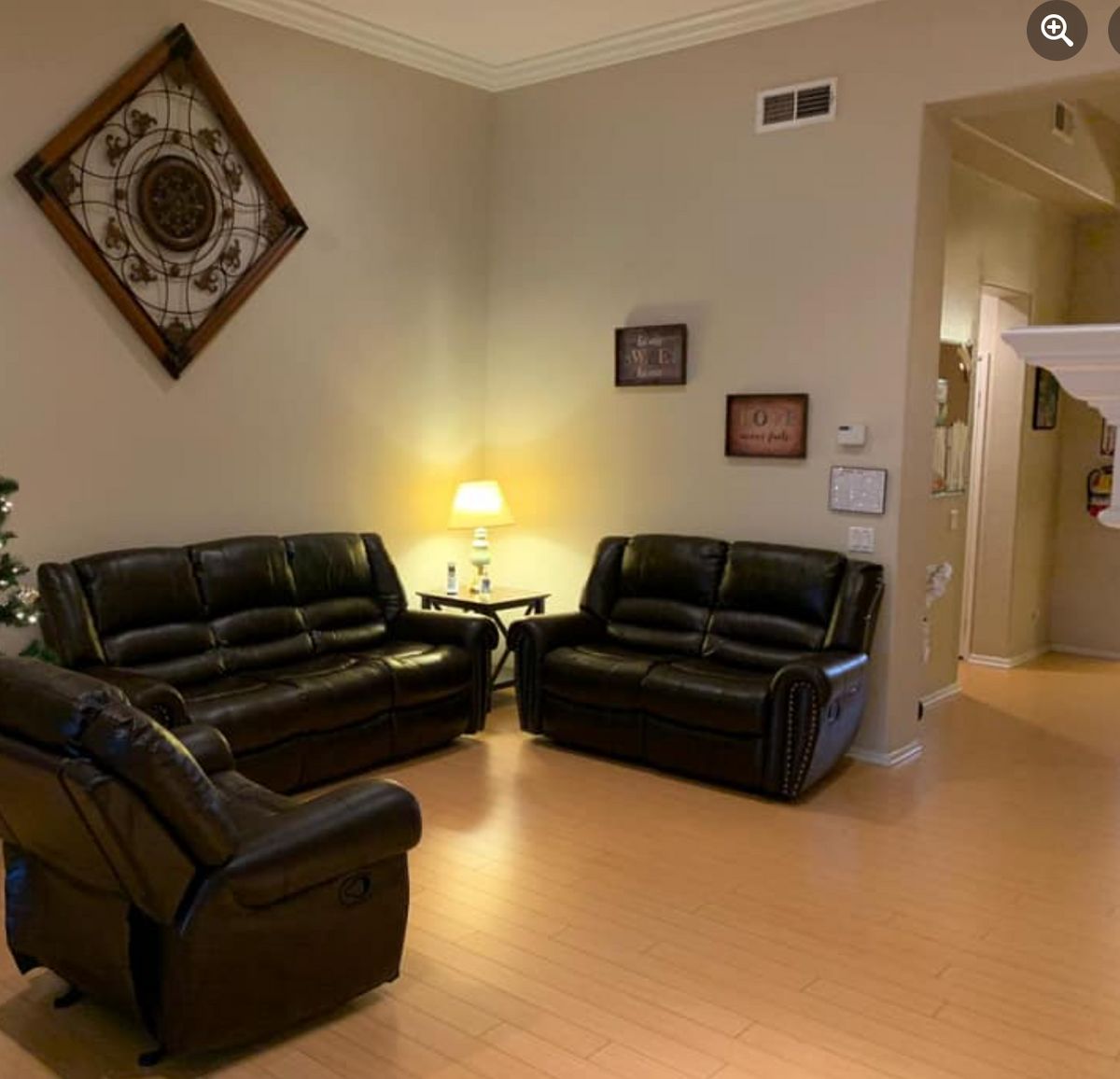 Interior view of Mira Loma Senior Care living room with furniture, art, and architecture.