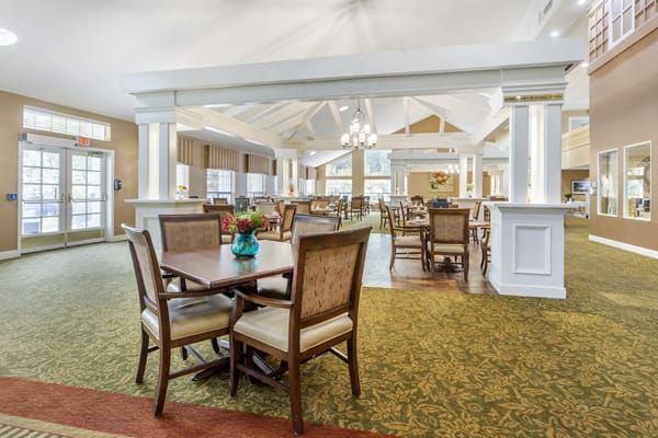Interior view of Brookdale Diablo Lodge senior living community featuring dining area and reception room.
