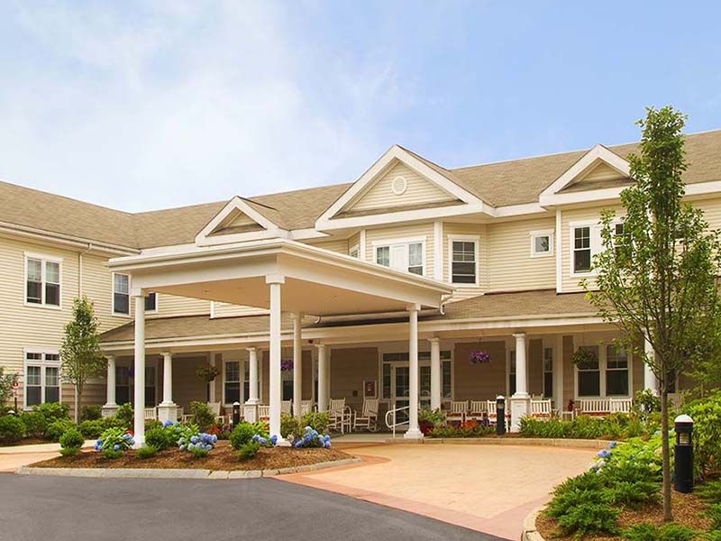 Senior living community, Atria Longmeadow Place, featuring architecture, art, and greenery.