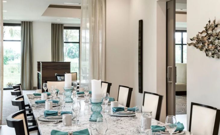 Interior design of Inspired Living Delray Beach senior community featuring dining room and decor.