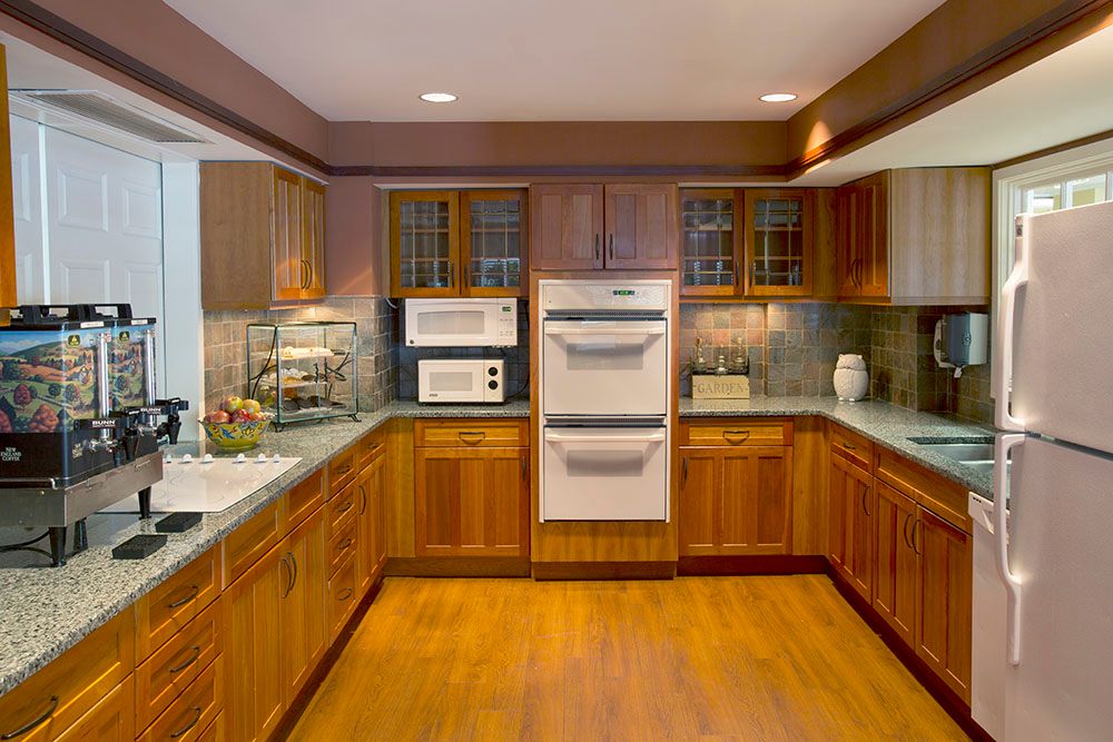 Interior view of a well-designed kitchen in Evans Park at Newton Corner senior living community.