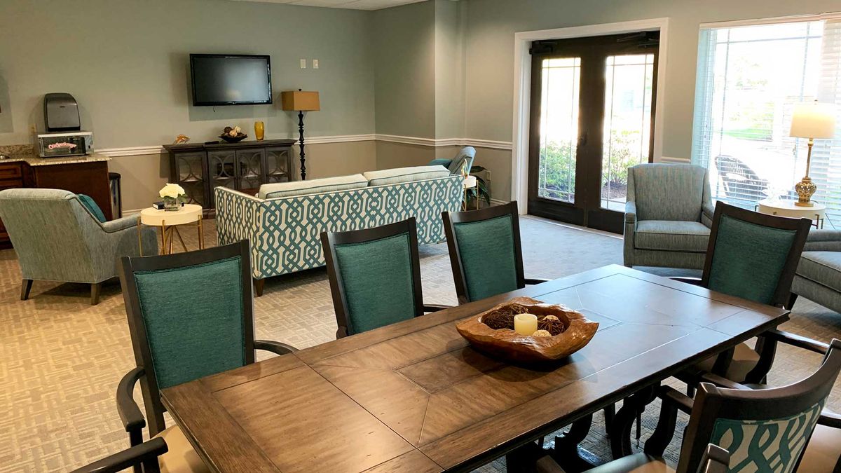 Interior view of Maristone Of Providence senior living community featuring dining and living room decor.