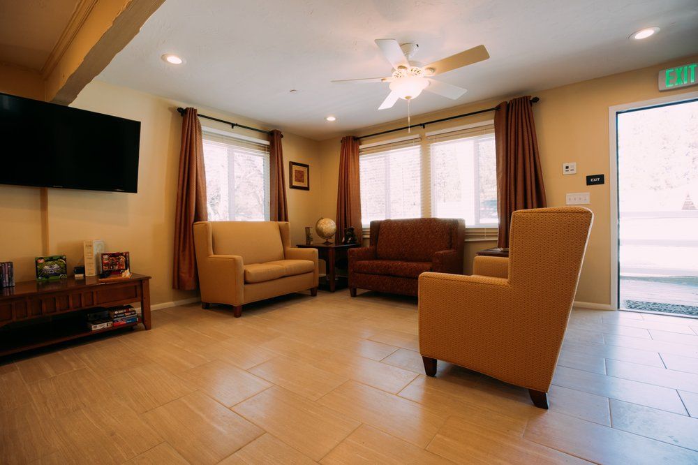 Interior view of Pacific Pines senior living community with modern electronics and cozy decor.