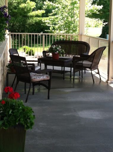 Senior living community, Aspen Creek of Sullivan, featuring balcony, porch, and backyard views.
