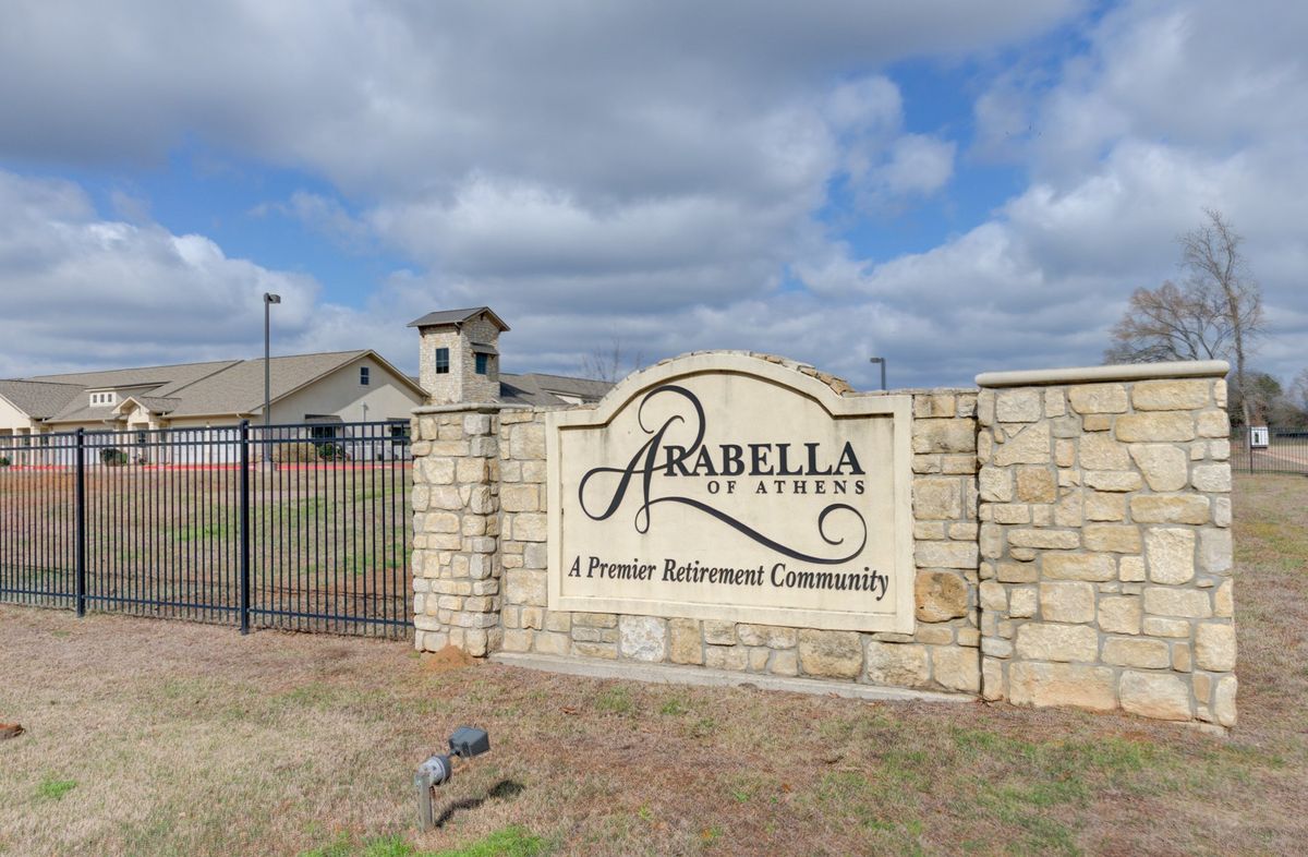 Senior living community, Arabella of Athens, featuring lush park, buildings and residents.