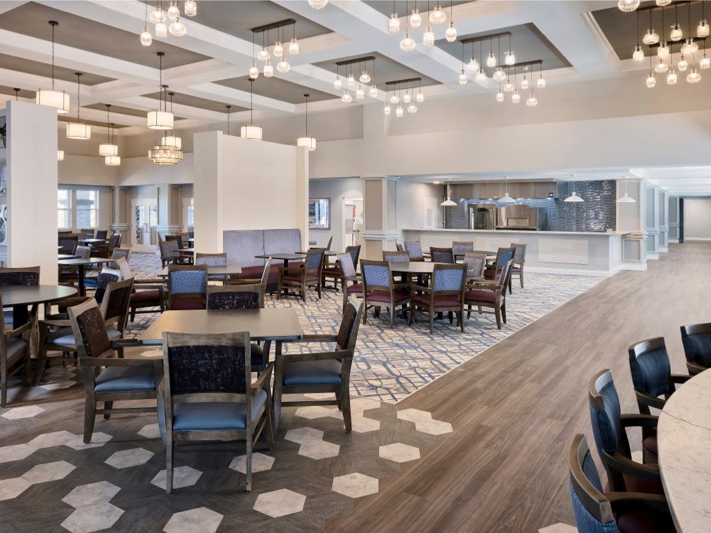 Interior view of WellQuest Granite Bay senior living community featuring lounge, dining area, and foyer.