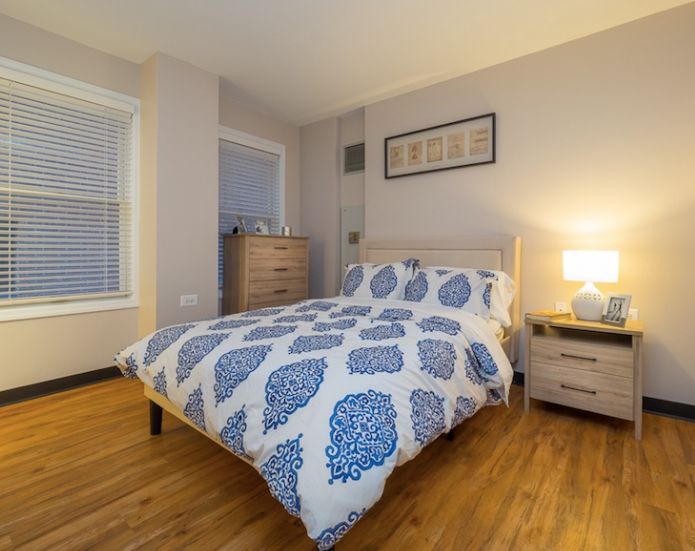 Interior view of a well-furnished bedroom at Covenant Home senior living community in Chicago.