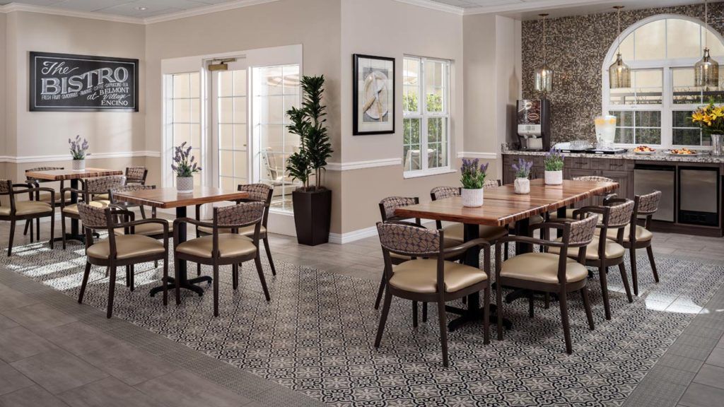 Interior view of Belmont Village Senior Living Encino featuring dining room with furniture and decor.
