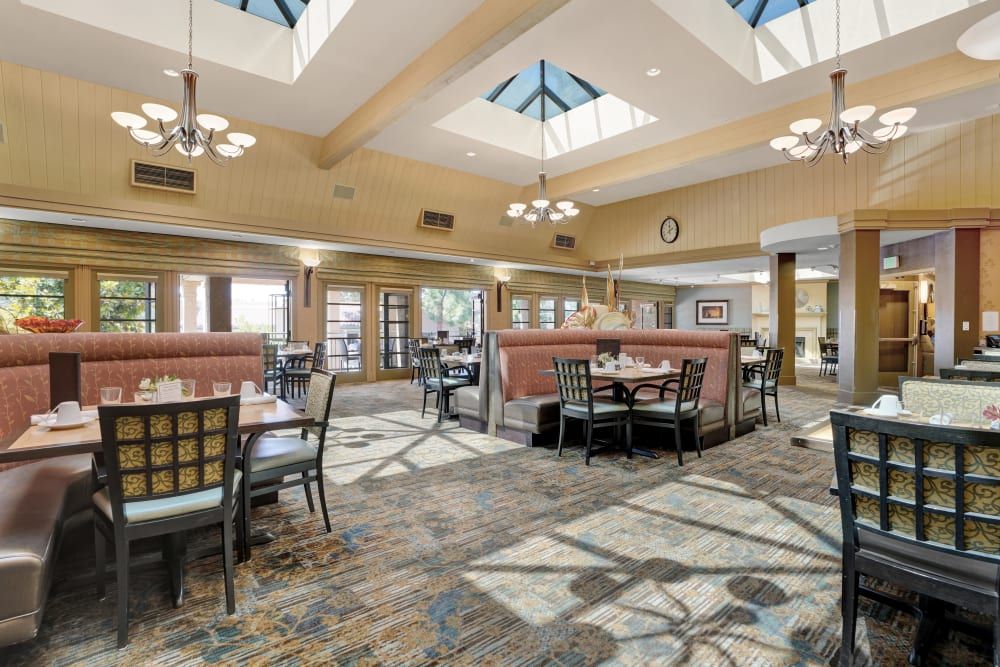 Senior living community, The Reserve At Thousand Oaks, featuring elegant dining room and lounge area.