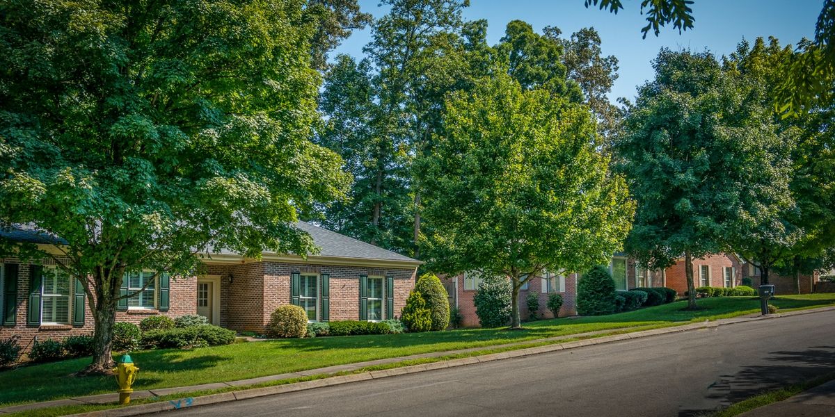 Shannondale Knoxville senior living community nestled in lush green suburb with trees and lawns.