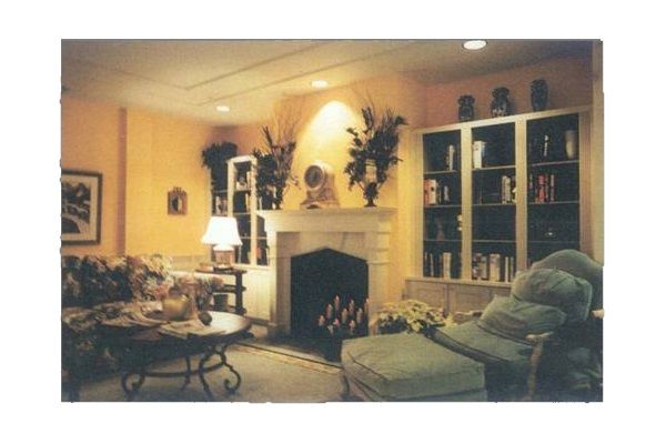 Senior man relaxing in the living room of The Villa At Saint Antoine with elegant interior design.